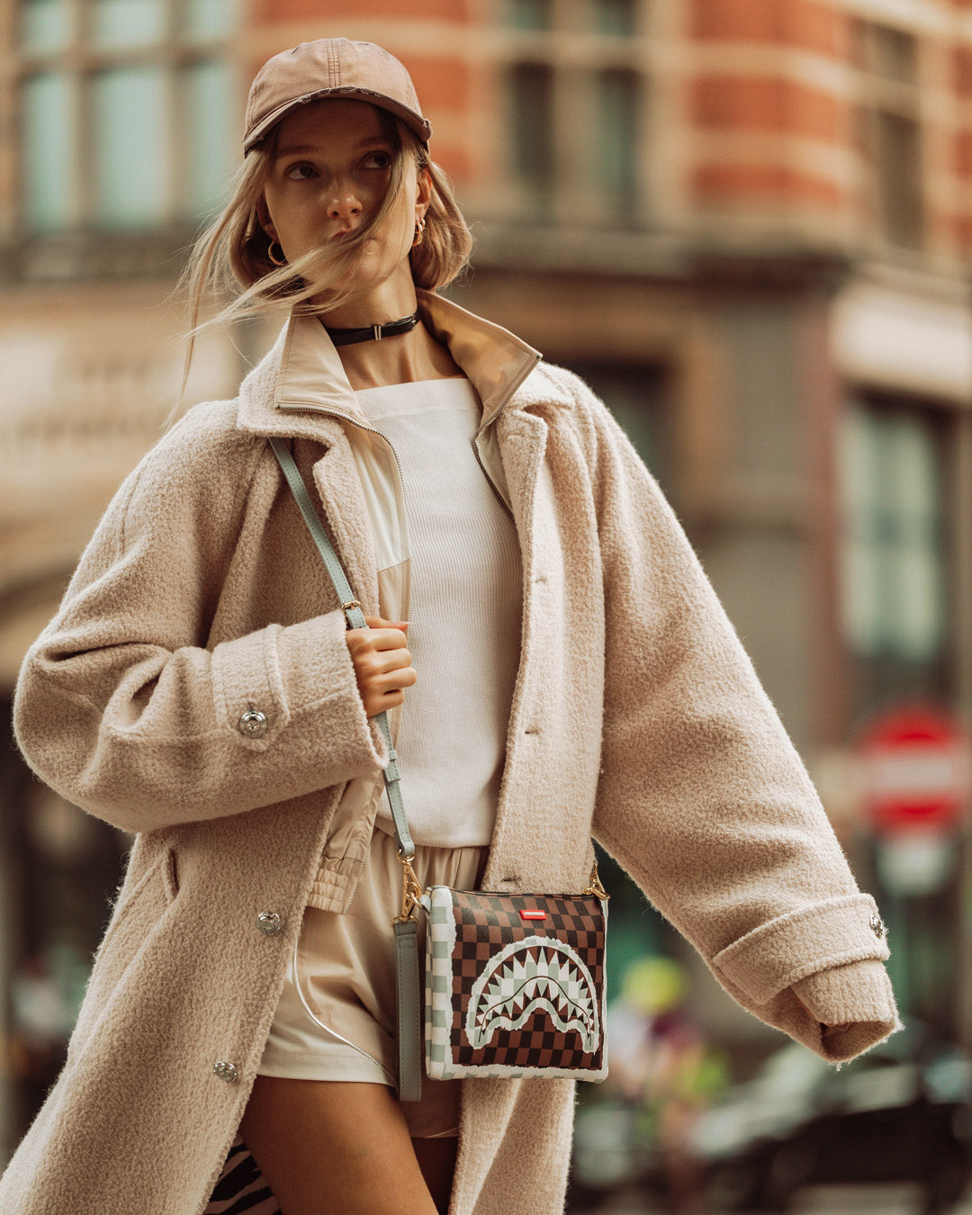 SPRAYGROUND® POUCHETTE CREAM AND BROWN TEAR CHECK CROSSOVER CLUTCH